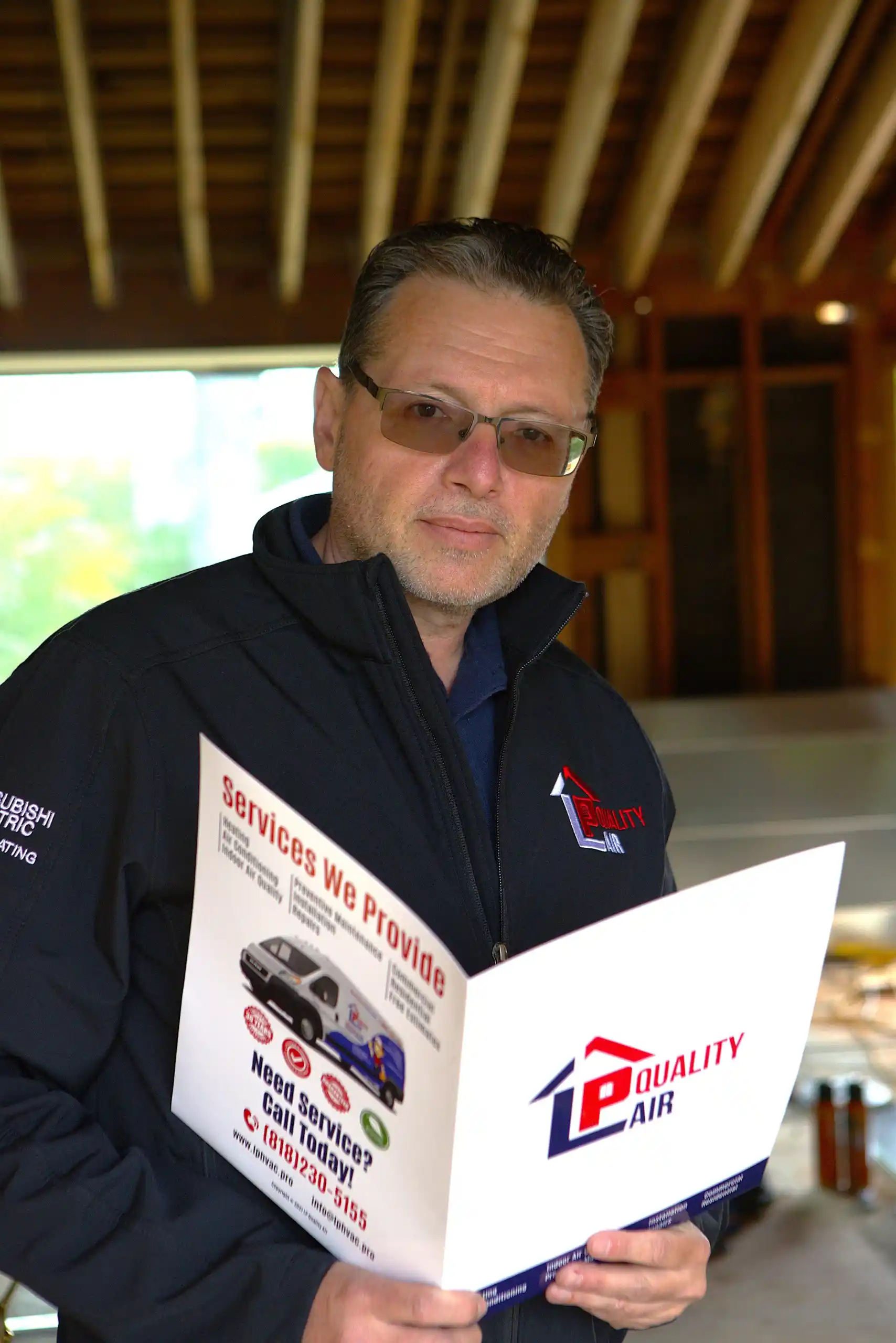 LP Quality technician performing a residential air conditioning installation.