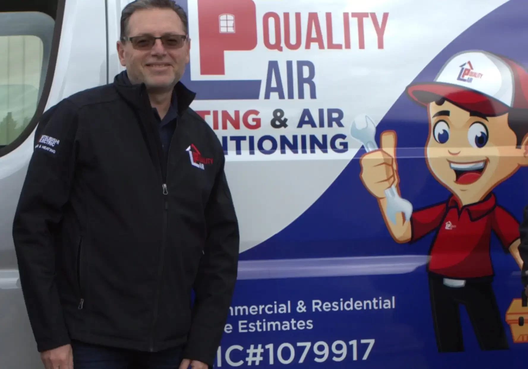 LP Quality HVAC technician standing next to a branded service van ready for a heat pump installation.
